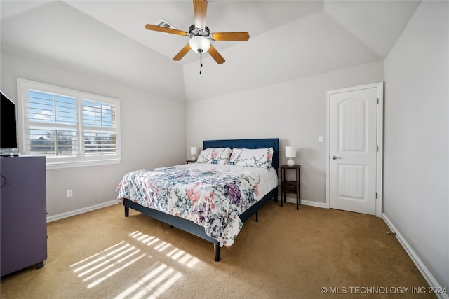 bedroom with carpet floors, ceiling fan, and vaulted ceiling