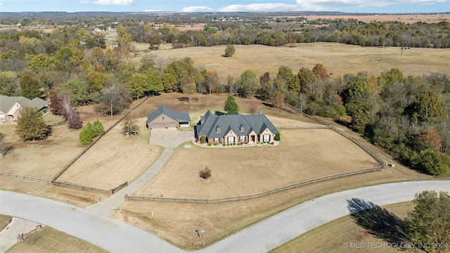 birds eye view of property with a rural view