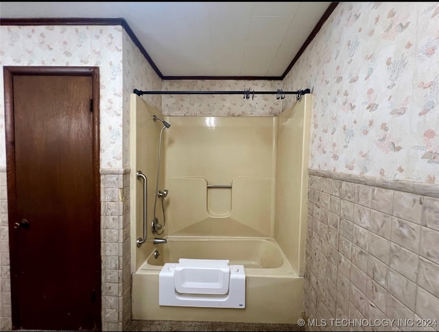 bathroom featuring bathtub / shower combination, tile walls, and ornamental molding