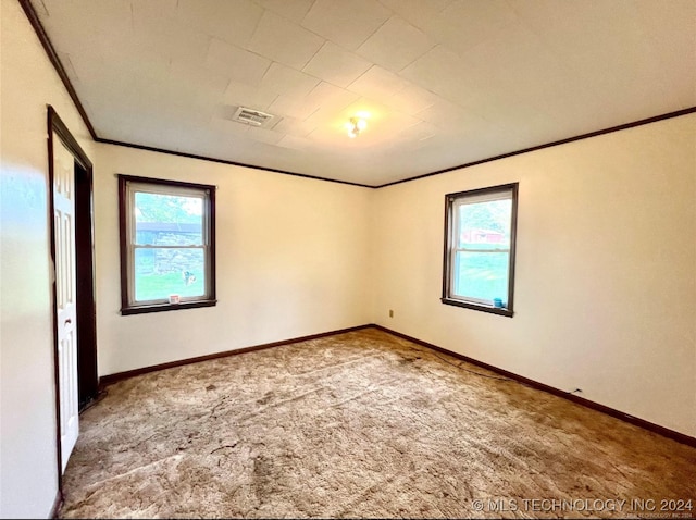 unfurnished room featuring carpet flooring