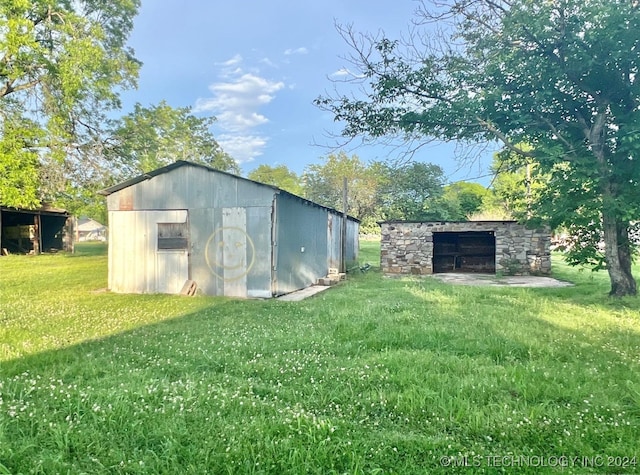 view of outdoor structure with a yard