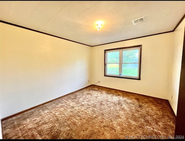 carpeted spare room with ornamental molding