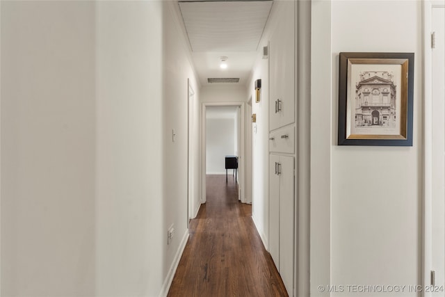 hall with dark hardwood / wood-style flooring