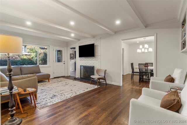 3920 S Utica Ave, Tulsa, OK 74105 - living area featuring dark wood-style flooring, beamed ceiling, a brick fireplace, a chandelier, and recessed lighting