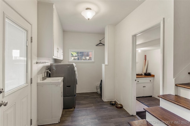 3920 S Utica Ave, Tulsa, OK 74105 - clothes washing area with cabinet space and dark wood-style flooring