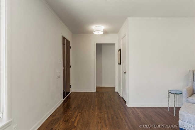 hallway featuring dark hardwood / wood-style flooring and crown molding