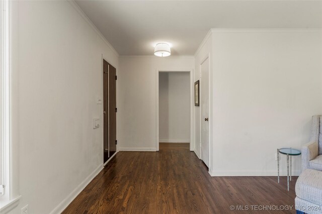 3920 S Utica Ave, Tulsa, OK 74105 - hall with dark wood-style floors, baseboards, and crown molding