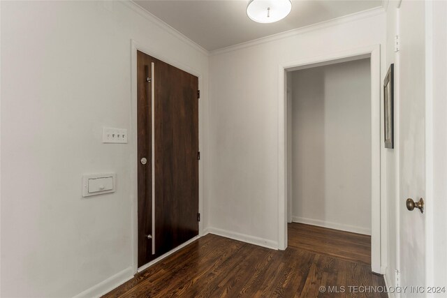 3920 S Utica Ave, Tulsa, OK 74105 - hall with ornamental molding, dark wood-style flooring, and baseboards