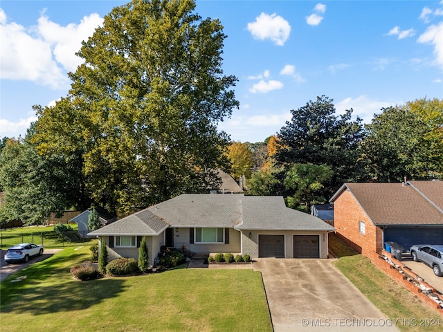 single story home with a front lawn and a garage