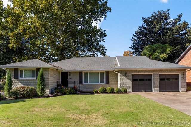 3920 S Utica Ave, Tulsa, OK 74105 - single story home featuring a garage, a front lawn, concrete driveway, brick siding, and a shingled roof