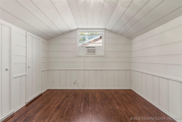 3920 S Utica Ave, Tulsa, OK 74105 - additional living space featuring dark wood-style flooring, cooling unit, a decorative wall, and lofted ceiling
