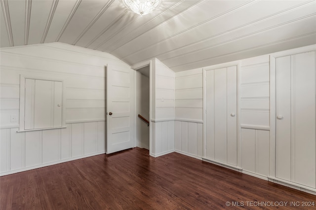 additional living space with lofted ceiling and dark hardwood / wood-style floors