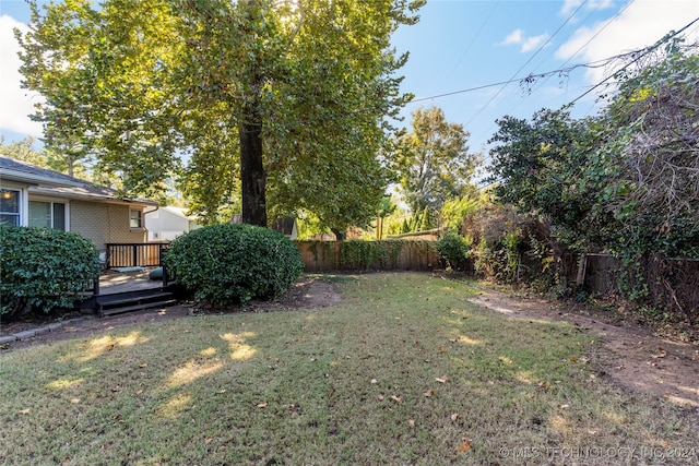 view of yard with a deck