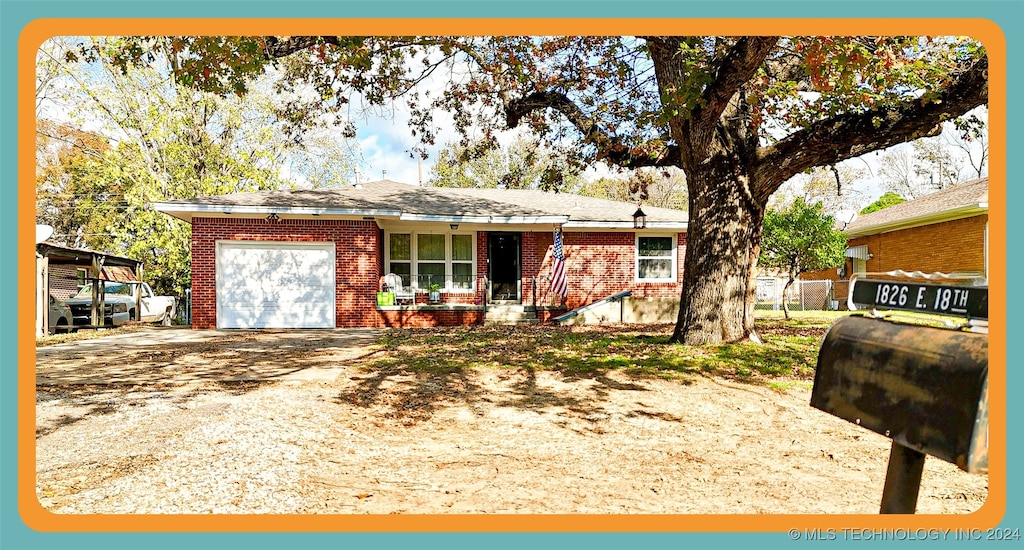 single story home featuring a garage