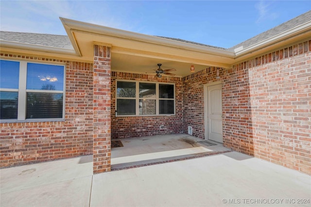 property entrance with ceiling fan and a patio