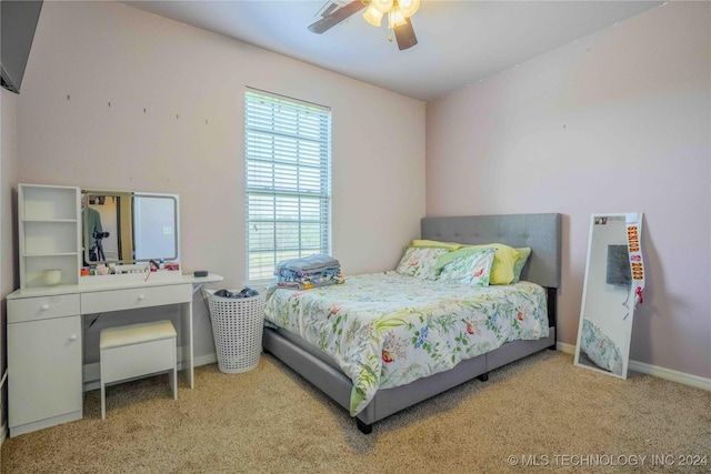 bedroom with ceiling fan and light colored carpet