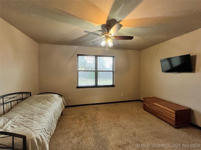 bedroom with ceiling fan and carpet floors