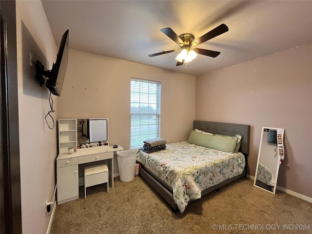 bedroom featuring ceiling fan and carpet flooring