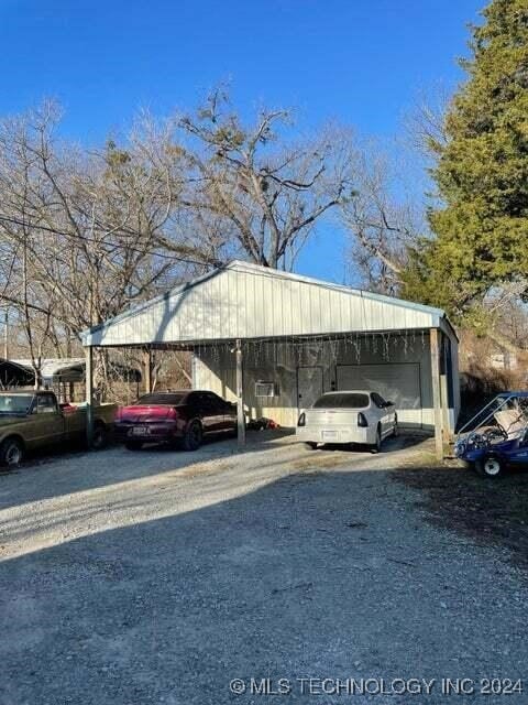 view of car parking with a carport