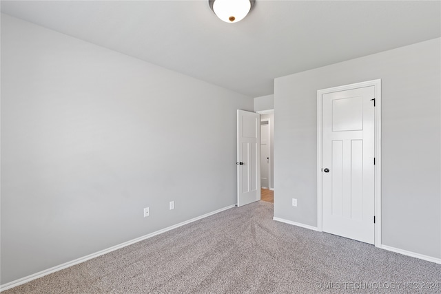 unfurnished bedroom featuring carpet