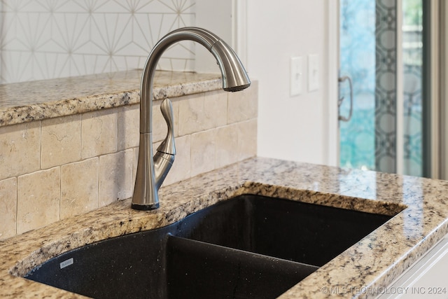 details featuring backsplash and sink