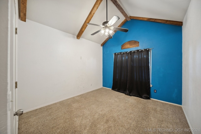 unfurnished room with beamed ceiling, ceiling fan, carpet floors, and high vaulted ceiling