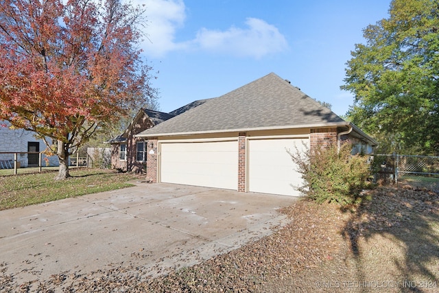 view of side of home featuring a lawn