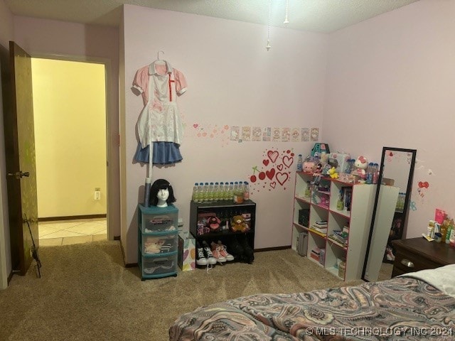 bedroom featuring light colored carpet