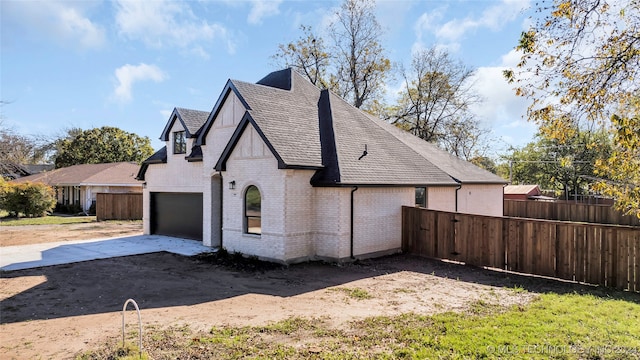 view of side of property featuring a garage