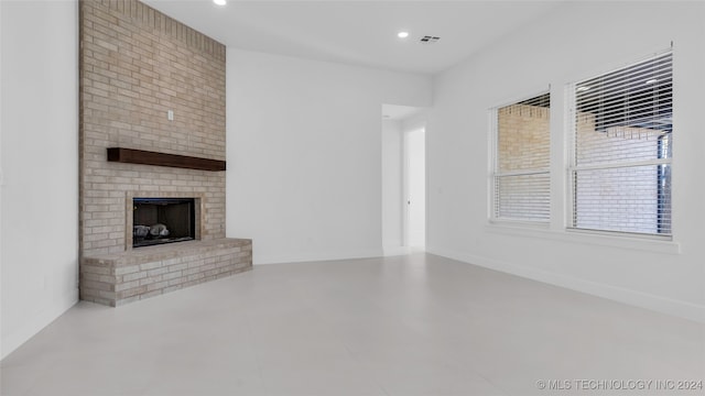 unfurnished living room featuring a fireplace