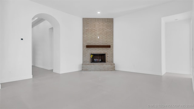 unfurnished living room with a fireplace