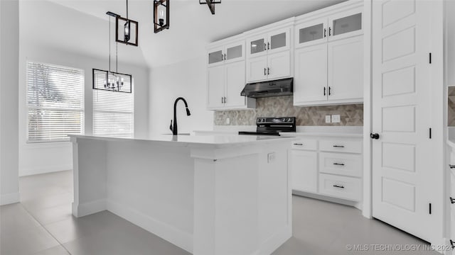 kitchen with black range with electric cooktop, sink, white cabinetry, hanging light fixtures, and an island with sink