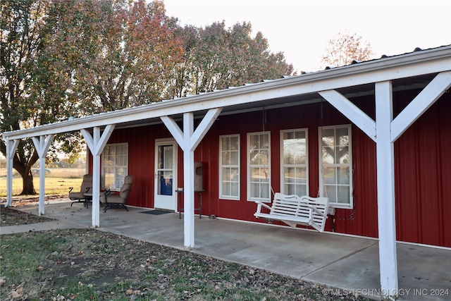 exterior space featuring a patio area and a porch