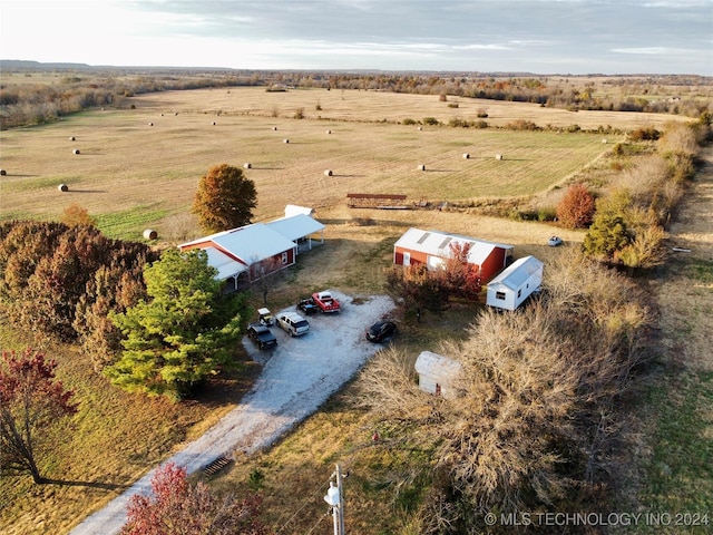 birds eye view of property with a rural view