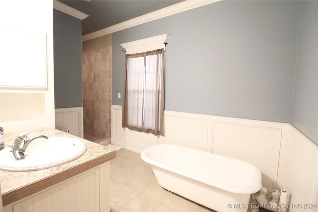 3998 E 173rd St S, Warner, OK 74469 - full bath featuring crown molding, wainscoting, vanity, a decorative wall, and a soaking tub