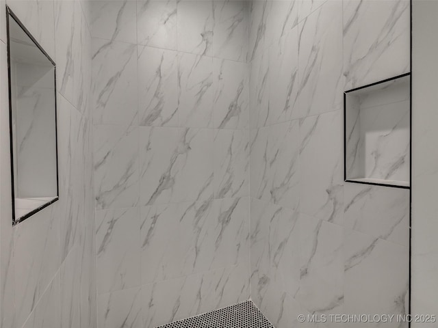 room details featuring tiled shower