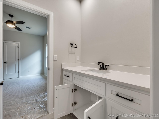 bathroom with ceiling fan and vanity