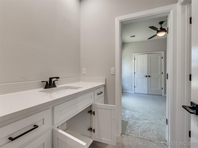 bathroom with ceiling fan and vanity