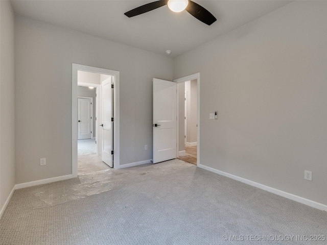 unfurnished bedroom with ceiling fan and light colored carpet