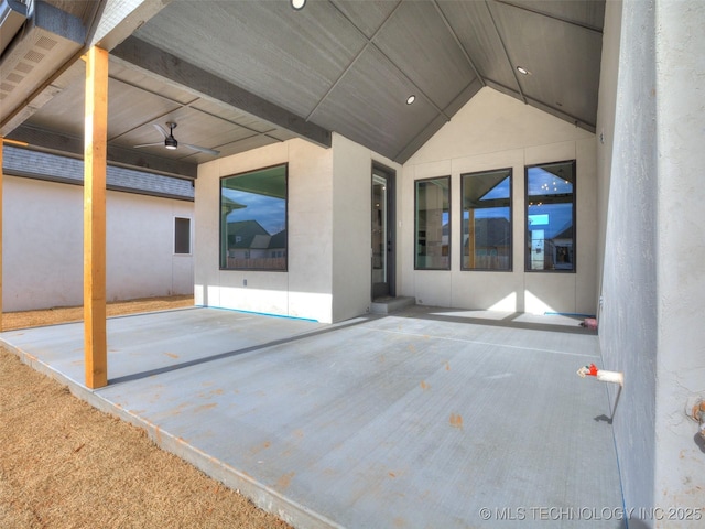 view of patio featuring ceiling fan