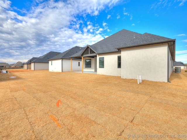 back of property with central air condition unit