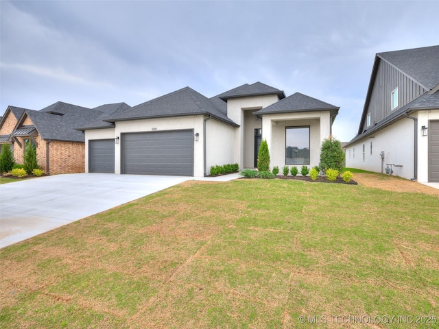 prairie-style home featuring a front lawn, concrete driveway, a garage, a shingled roof, and stucco siding