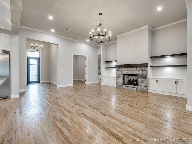 unfurnished living room with recessed lighting, ornamental molding, a chandelier, and light wood-style flooring
