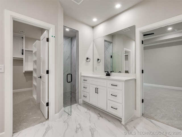 bathroom featuring baseboards, a marble finish shower, and marble finish floor