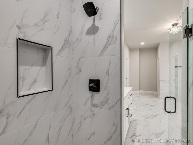 full bath featuring marble finish floor, vanity, a marble finish shower, and recessed lighting