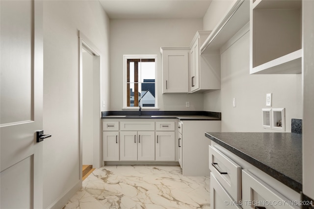 kitchen with white cabinets and sink