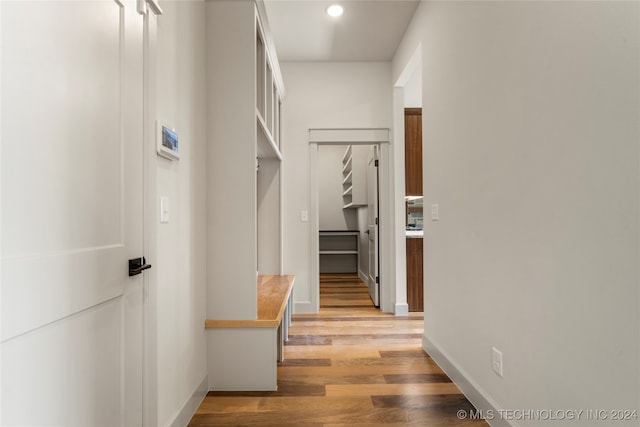 corridor with light wood-type flooring