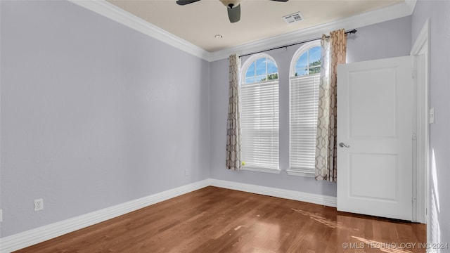 spare room featuring ornamental molding, ceiling fan, and dark hardwood / wood-style flooring