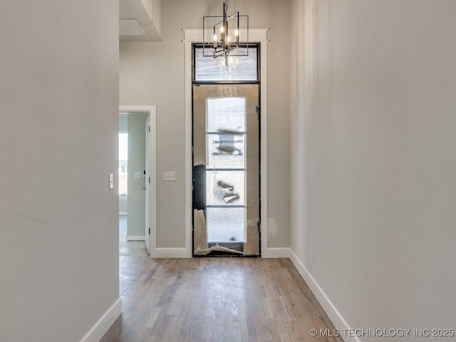 entryway featuring a notable chandelier and light hardwood / wood-style floors