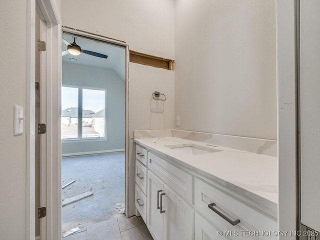 bathroom featuring ceiling fan, tile patterned floors, and vanity